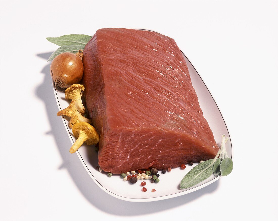A piece of beef on white bowl