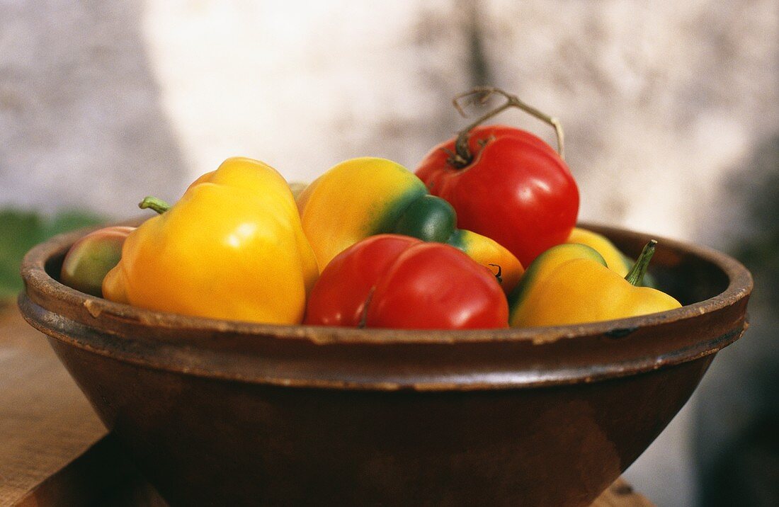 Red and yellow peppers in a bowl