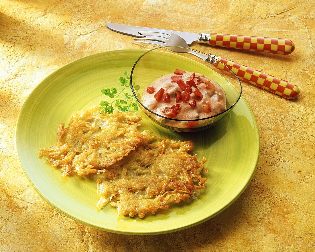 Two potato pancakes with pepper dip