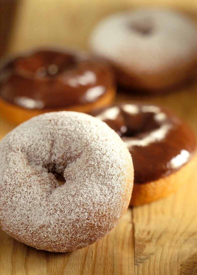 Doughnuts with icing sugar and with chocolate icing