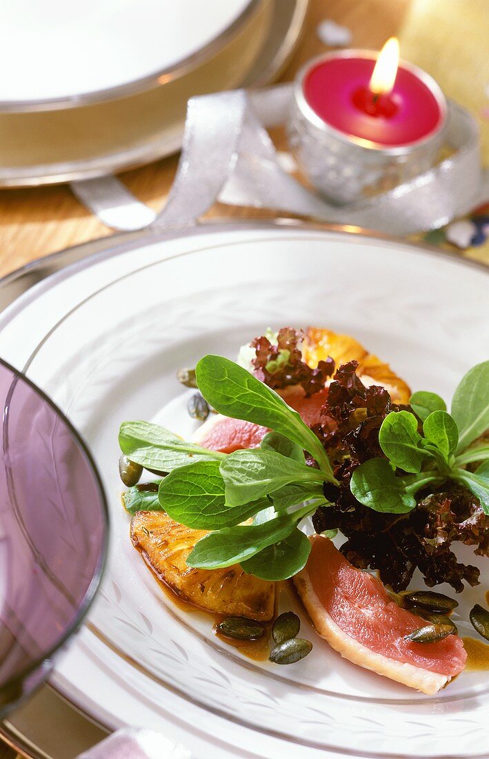 Salad with smoked duck breast and pineapple