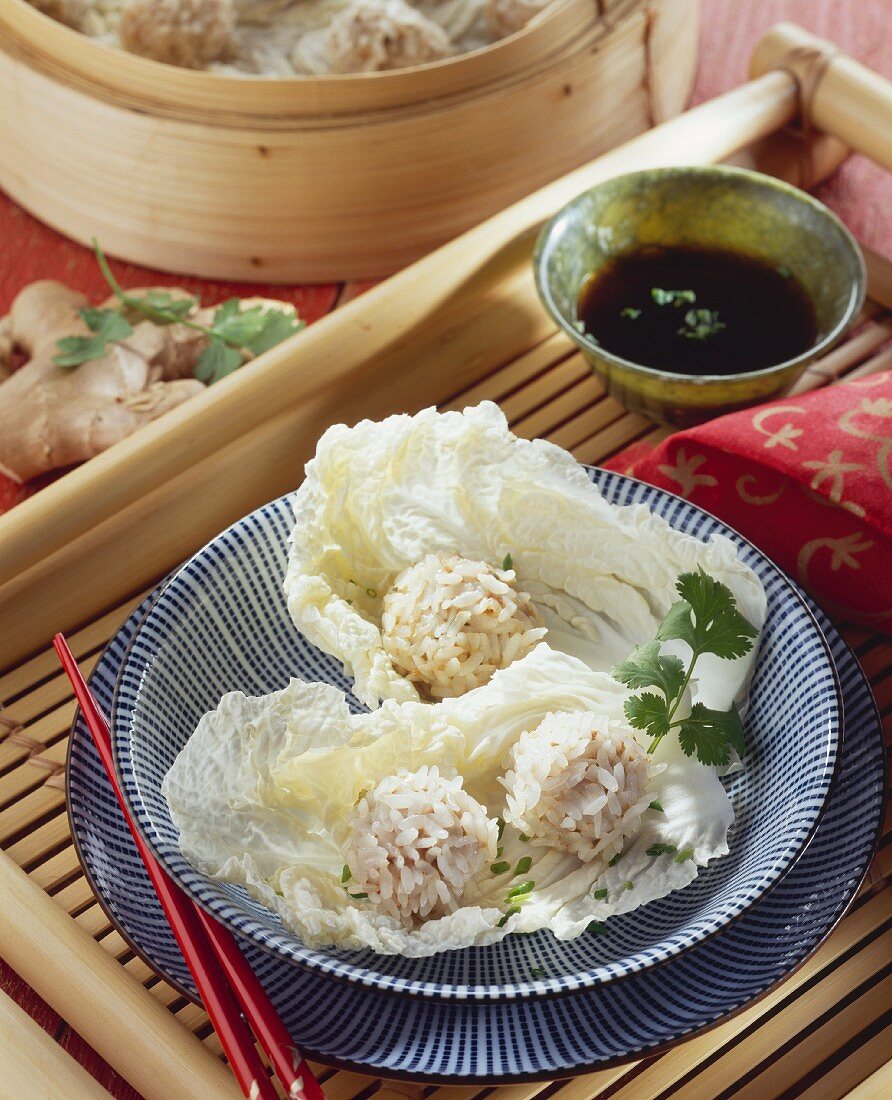 Asian rice balls on white cabbage leaves