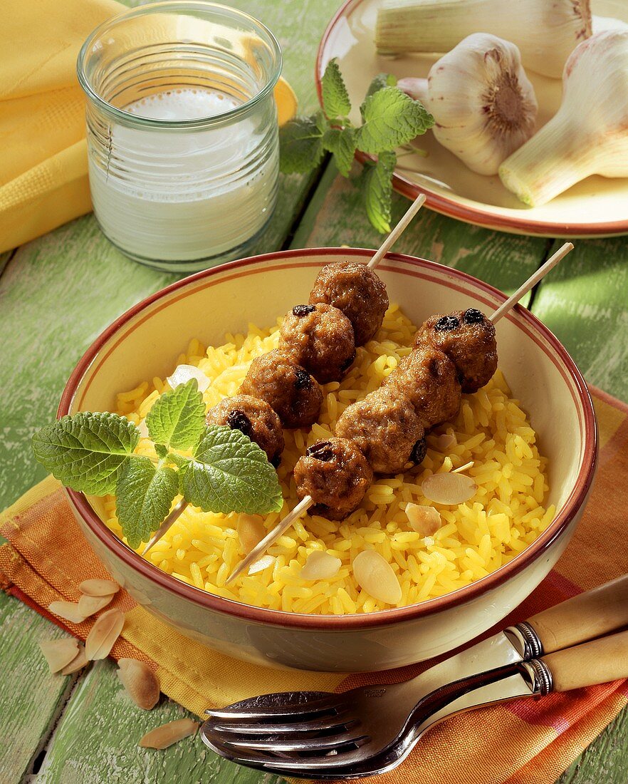 Mince kebabs on curried rice