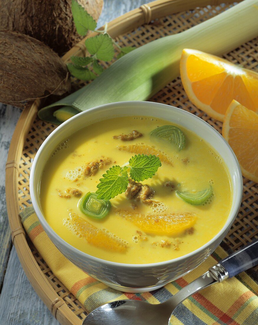 Orange and coconut soup with mince and leeks