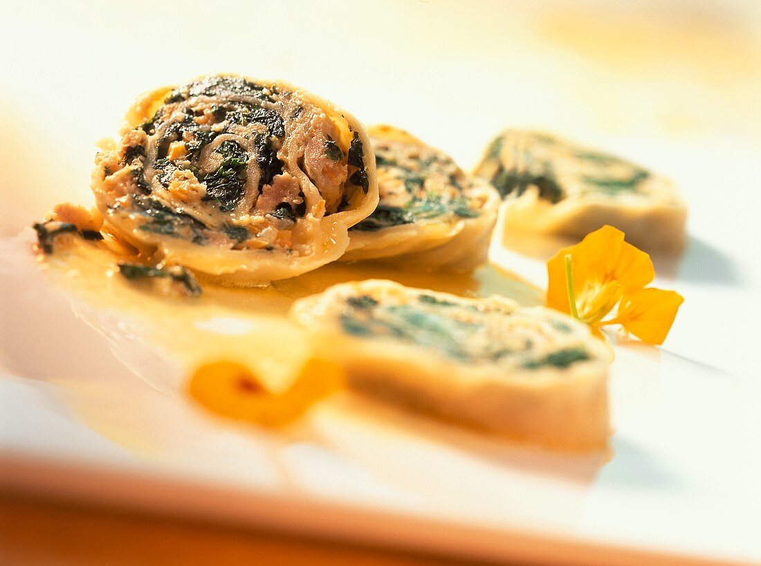 Pasta roulade with spinach and veal filling