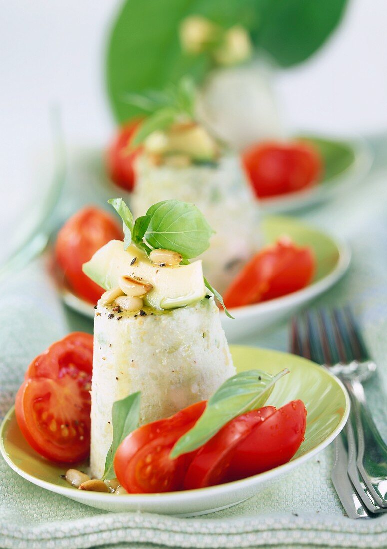 Avocado cheese flan with tomatoes, basil & pine nuts