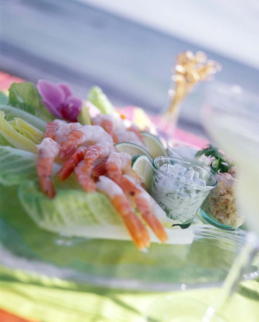 Shrimps on romaine lettuce with various dips (Bermuda)