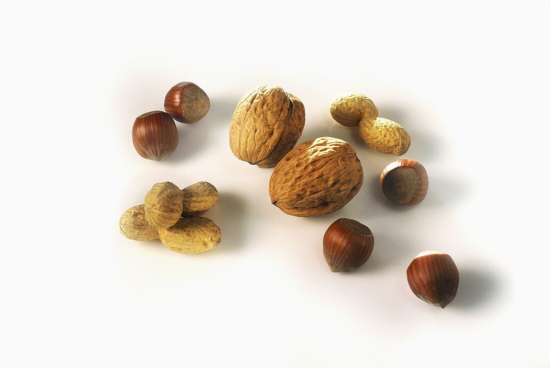 Peanuts, hazelnuts and walnuts with shells