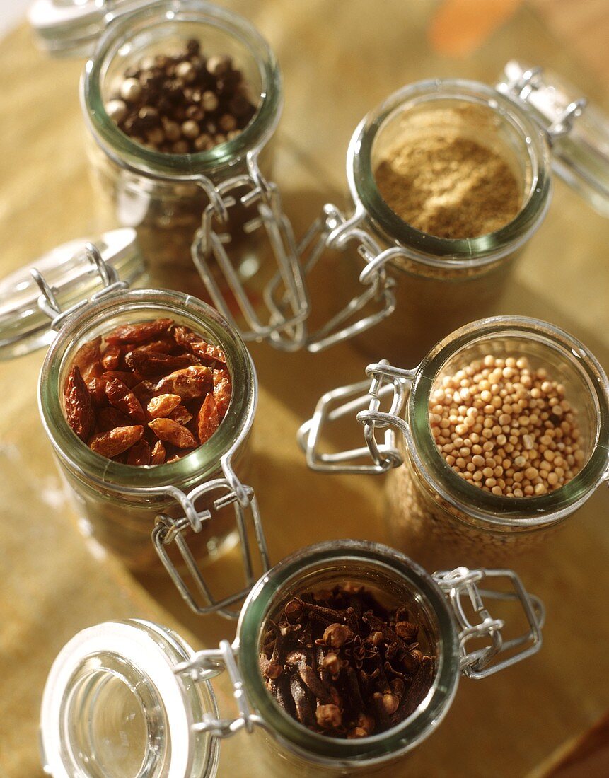 Various spices in small preserving jars