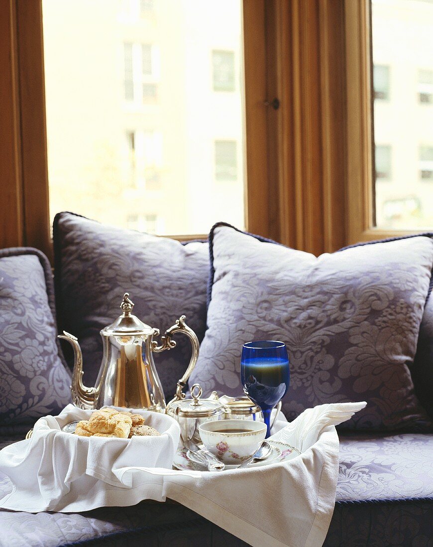 Breakfast tray on the couch of an elegant hotel