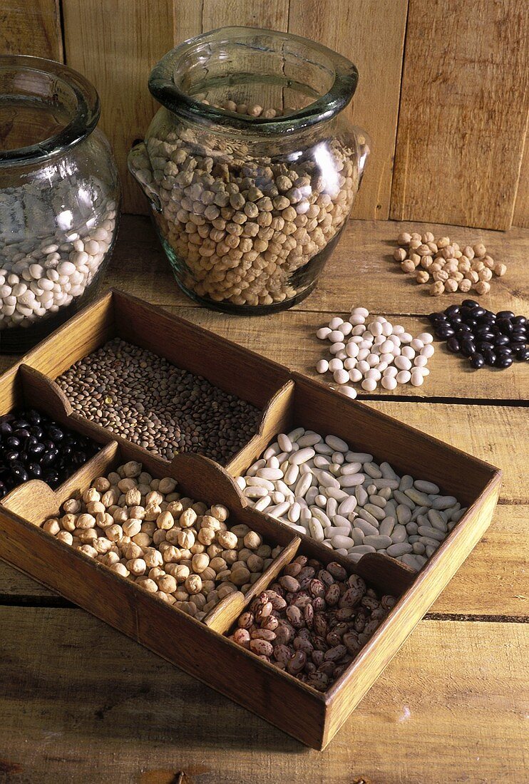 Dried pulses in typesetter's case and in jars