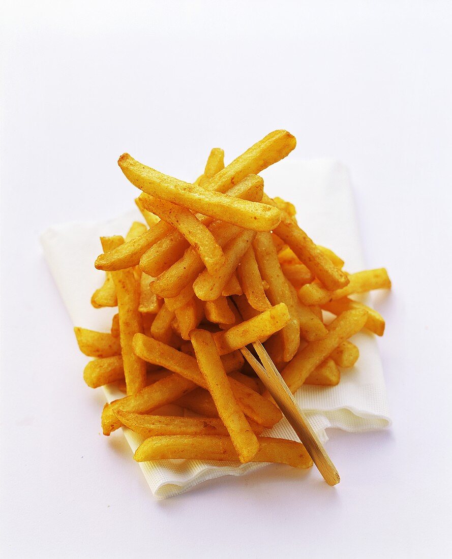 Chips on white napkin and wooden cocktail stick