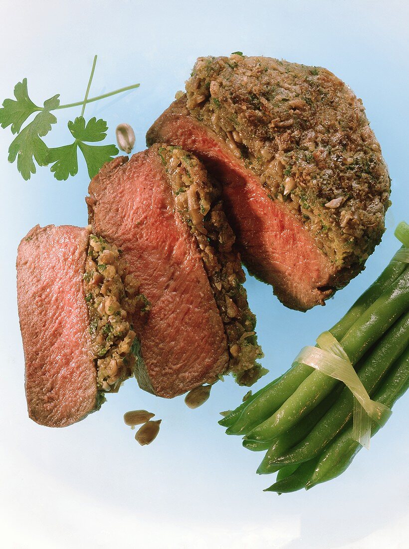 Beef fillet with sunflower crust and beans