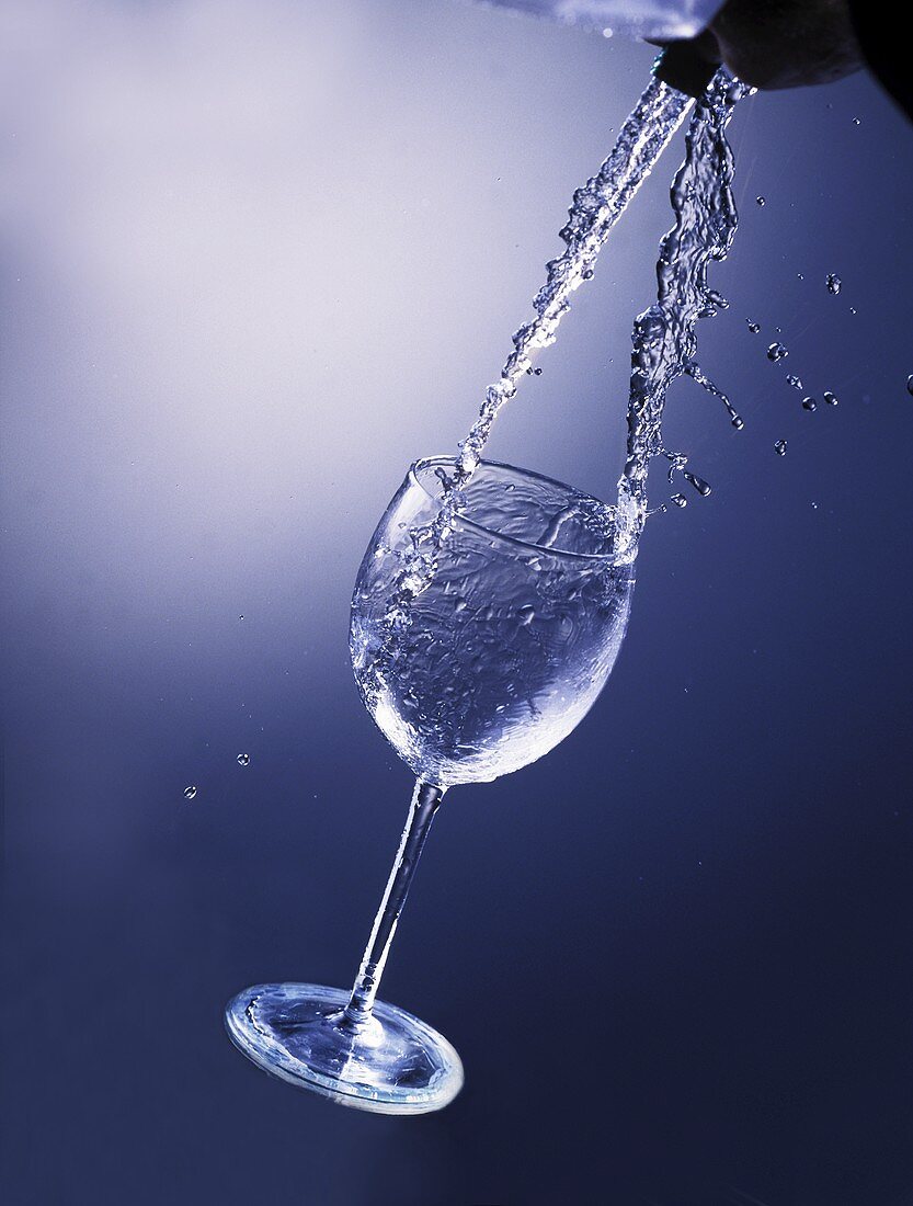 Pouring water into a glass