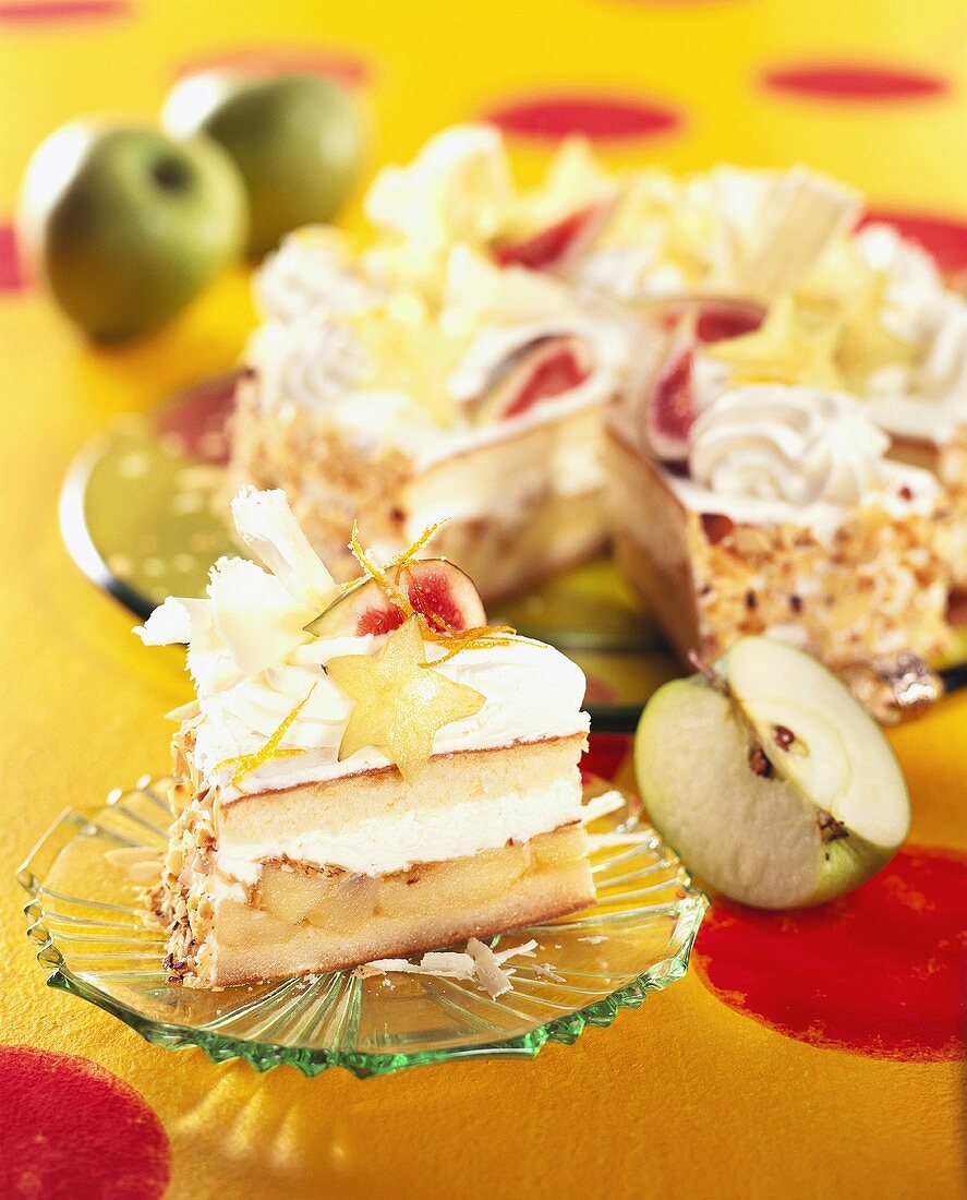 Apple cream gateau decorated with carambola slices and figs