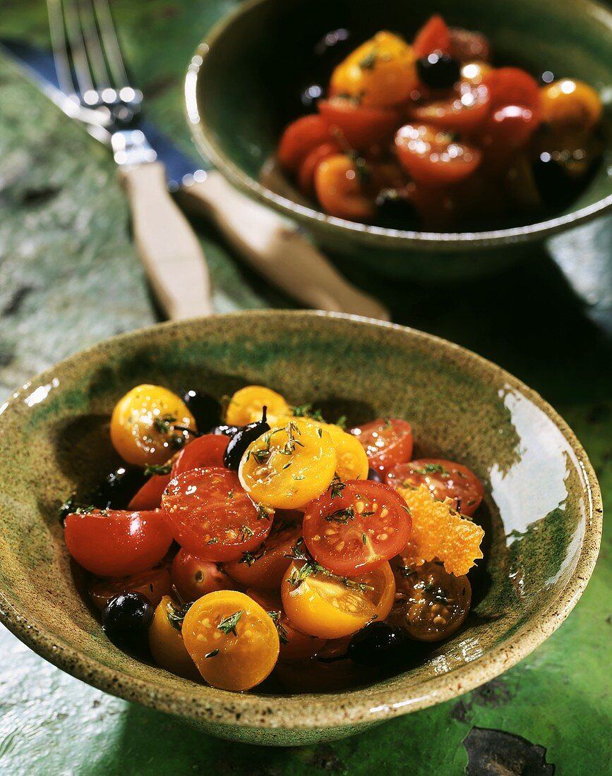Colourful cherry tomato salad with black olives