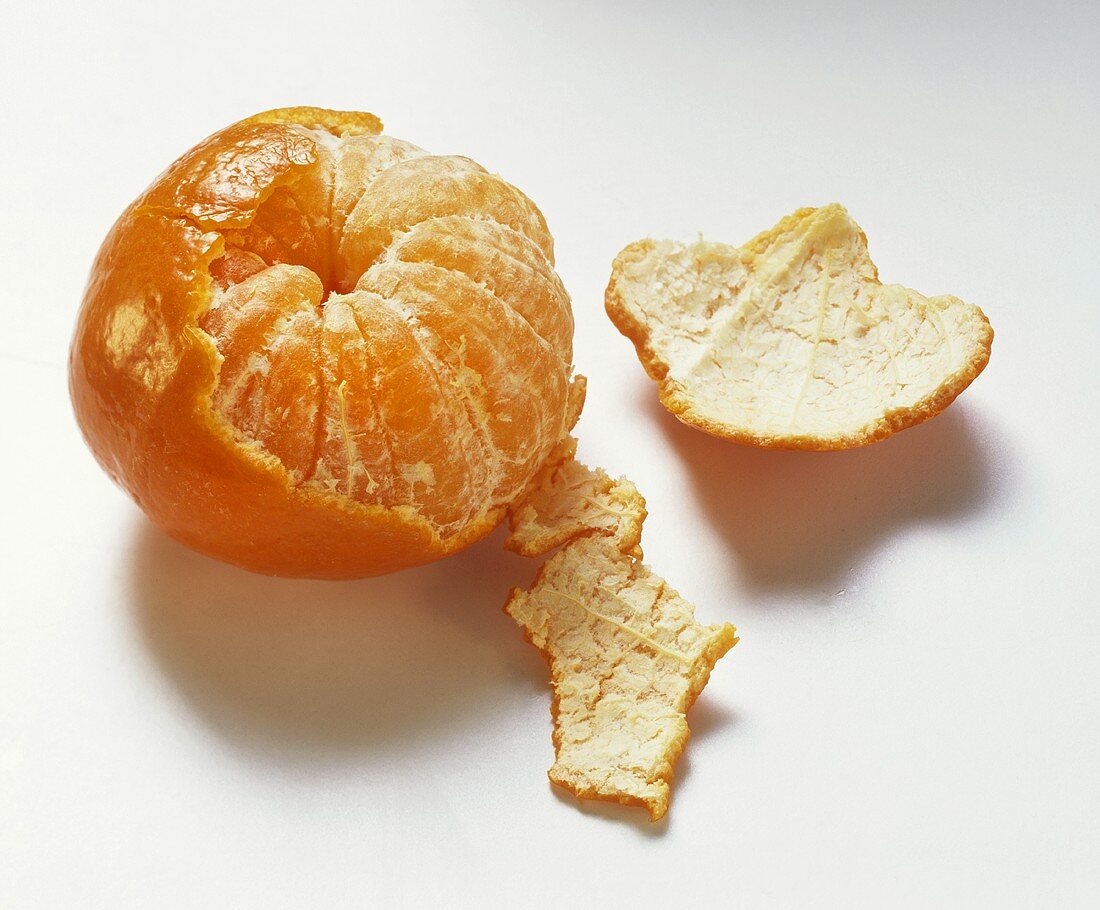 Half-peeled mandarin orange