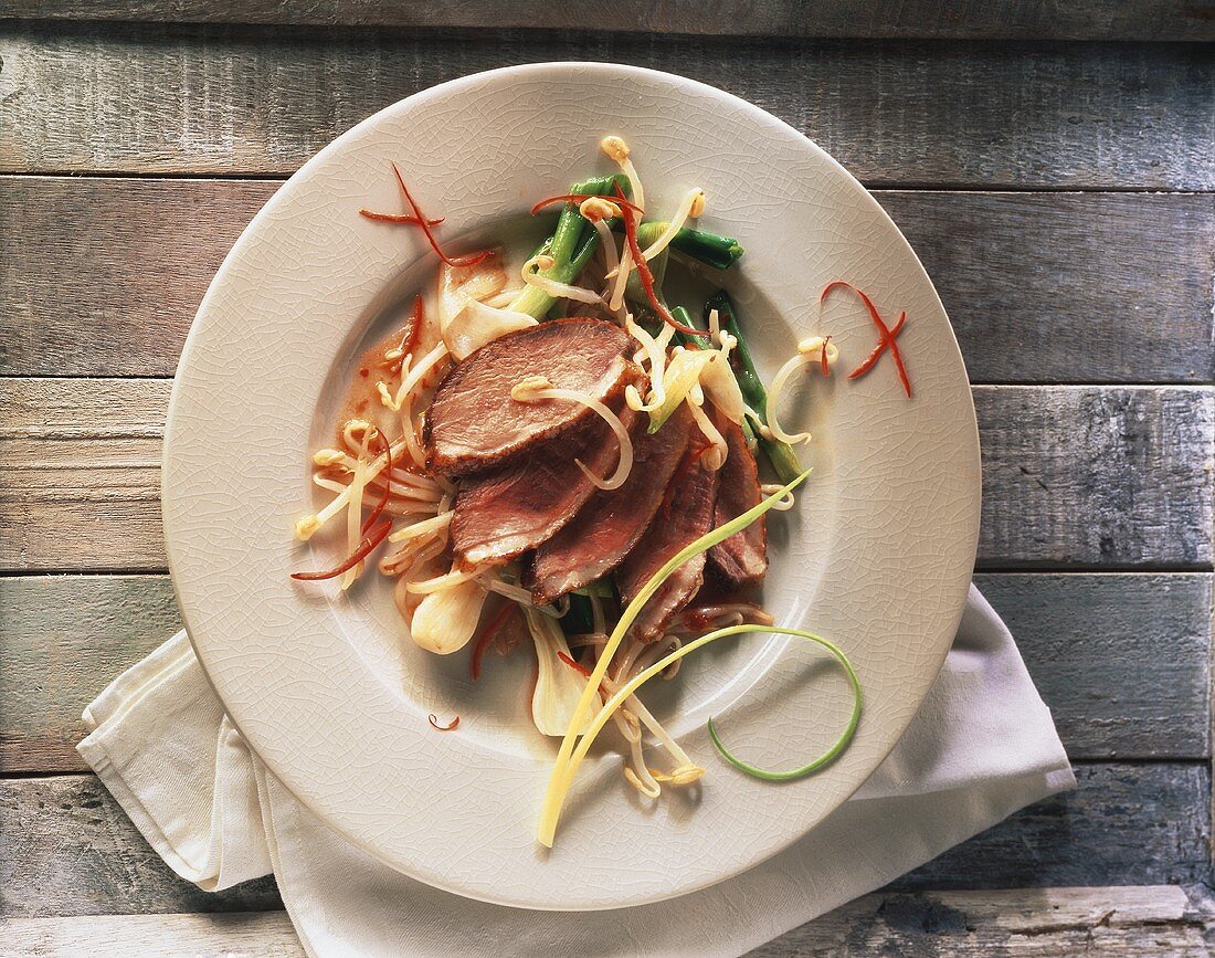 Duck breast with spring onions and mung bean sprouts