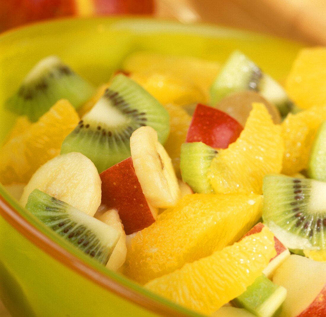 Fruit salad with tropical fruits and apples