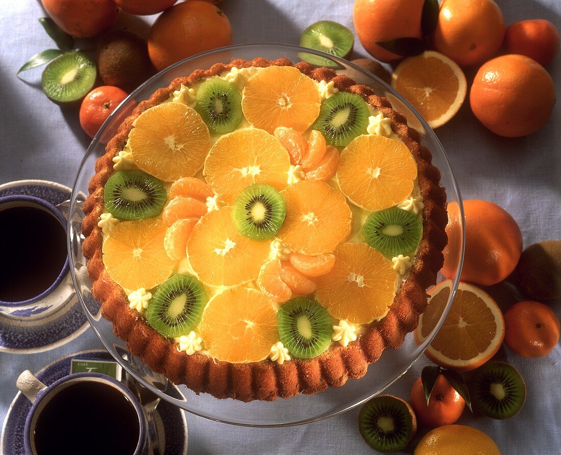 Fruit flan with oranges, mandarins and kiwi