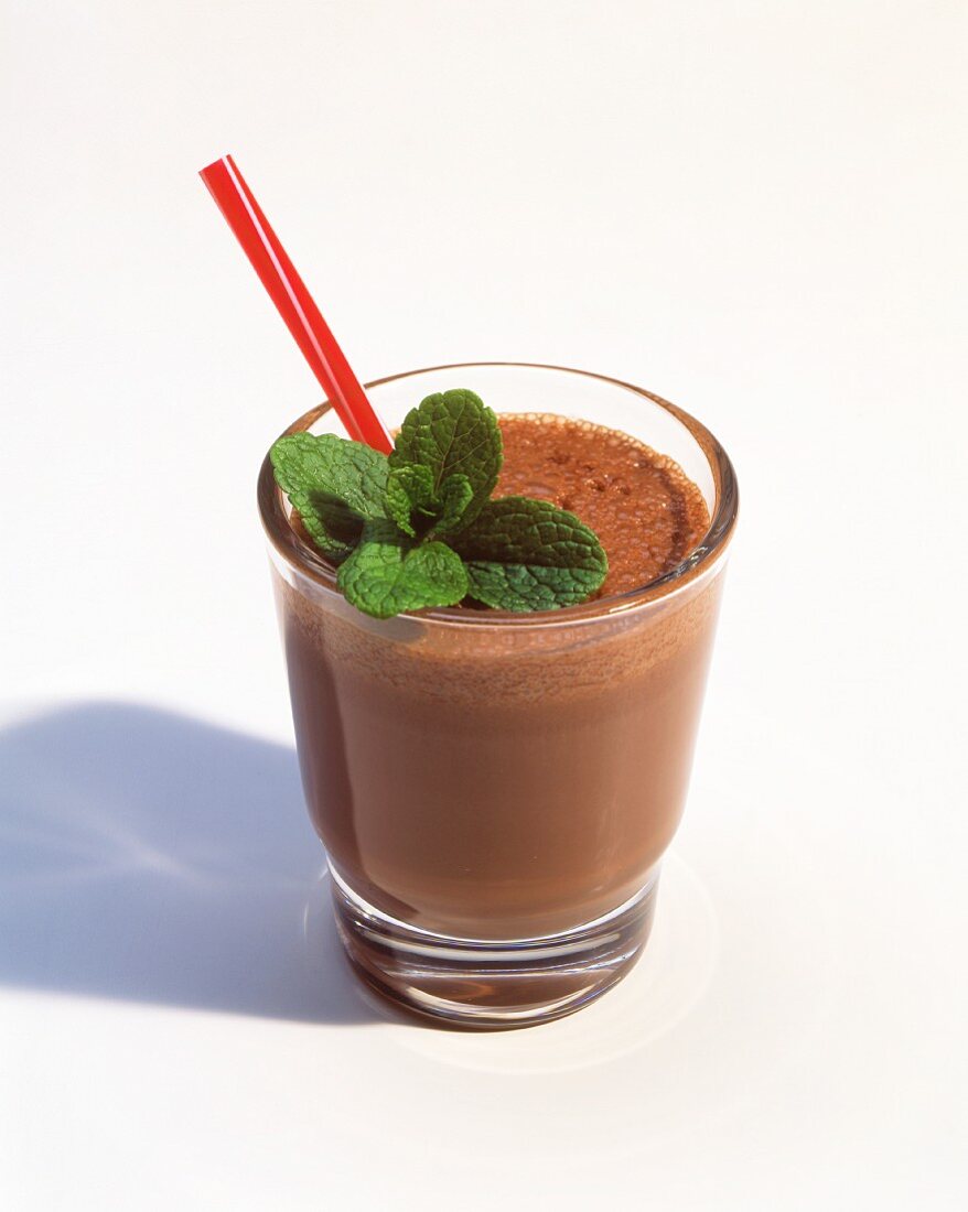 Chocolate Shake with Mint Leaves and a Red Straw
