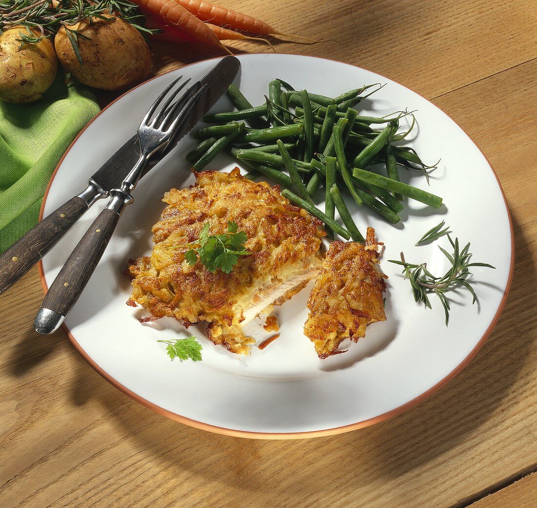 Pork escalope in potato crust with green beans