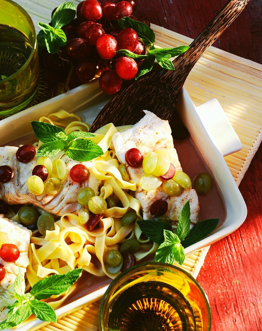 Cod fillet with ribbon noodles and grapes