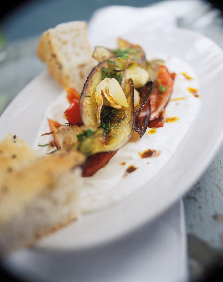 Roasted aubergines and peppers on yoghurt