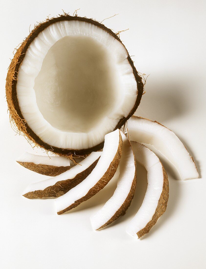 An opened coconut with coconut slices