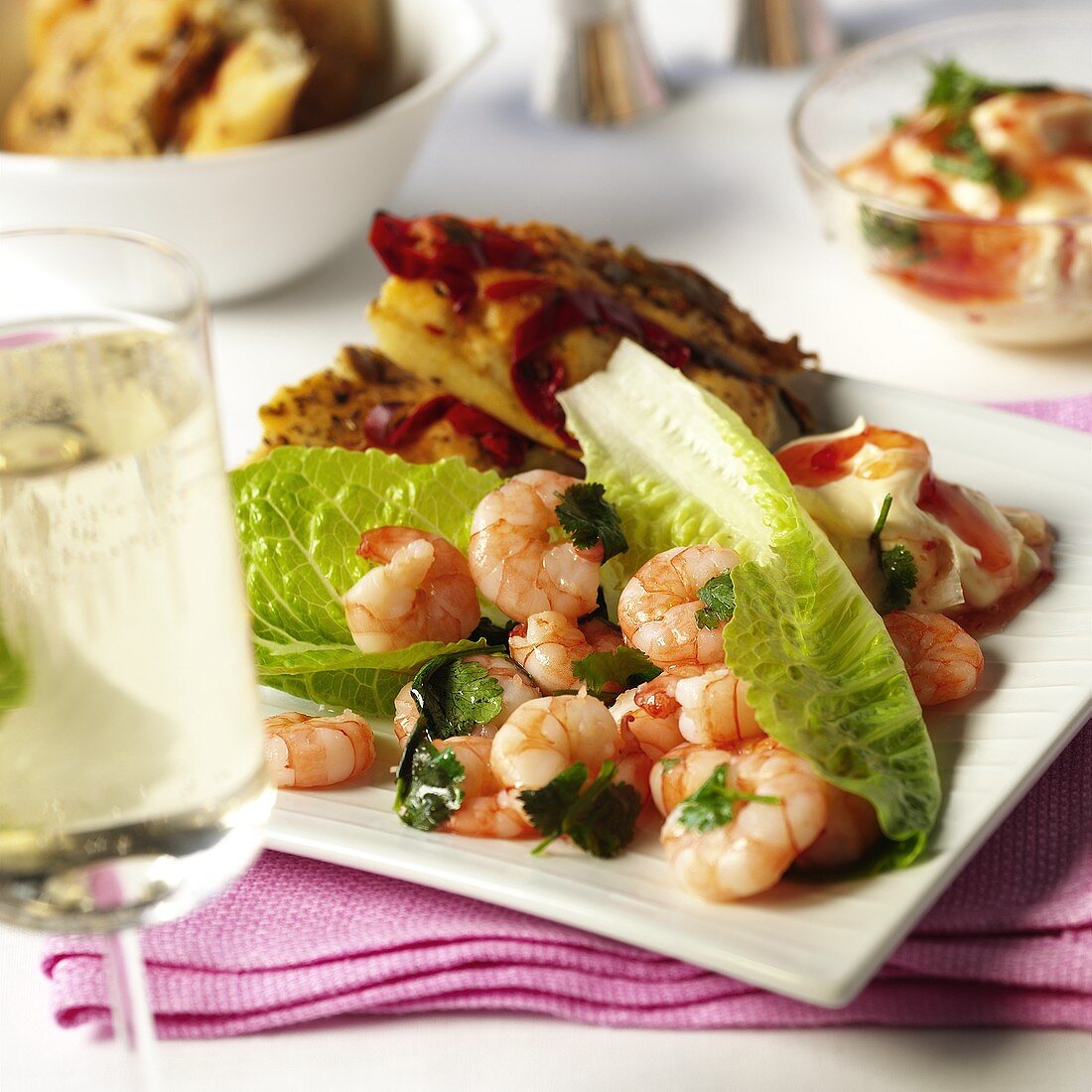 Shrimps with lettuce leaves, pepper sauce & chili bread