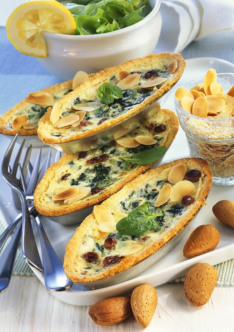 Spinach quiche with almonds and raisins