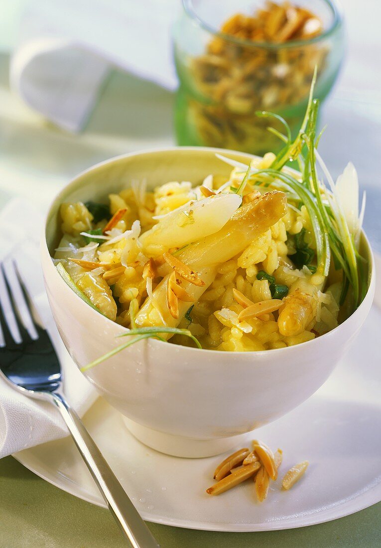 Asparagus risotto with spring onions and almond slivers