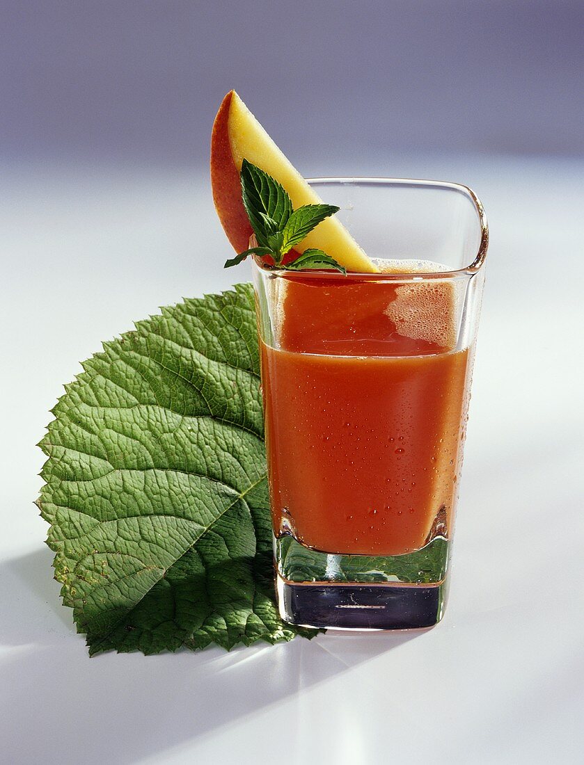 Vitamin drink with mango, papaya and blood oranges