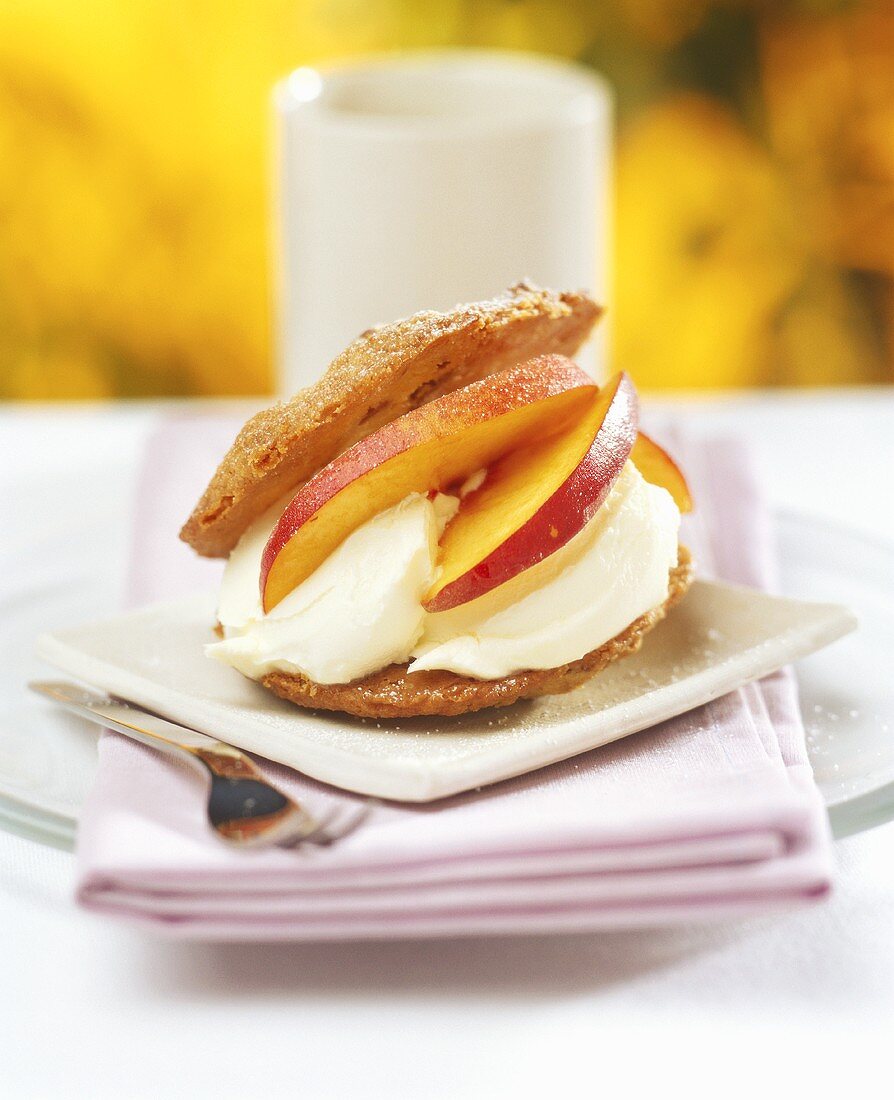 Sweet pastry with nectarine and ice cream filling