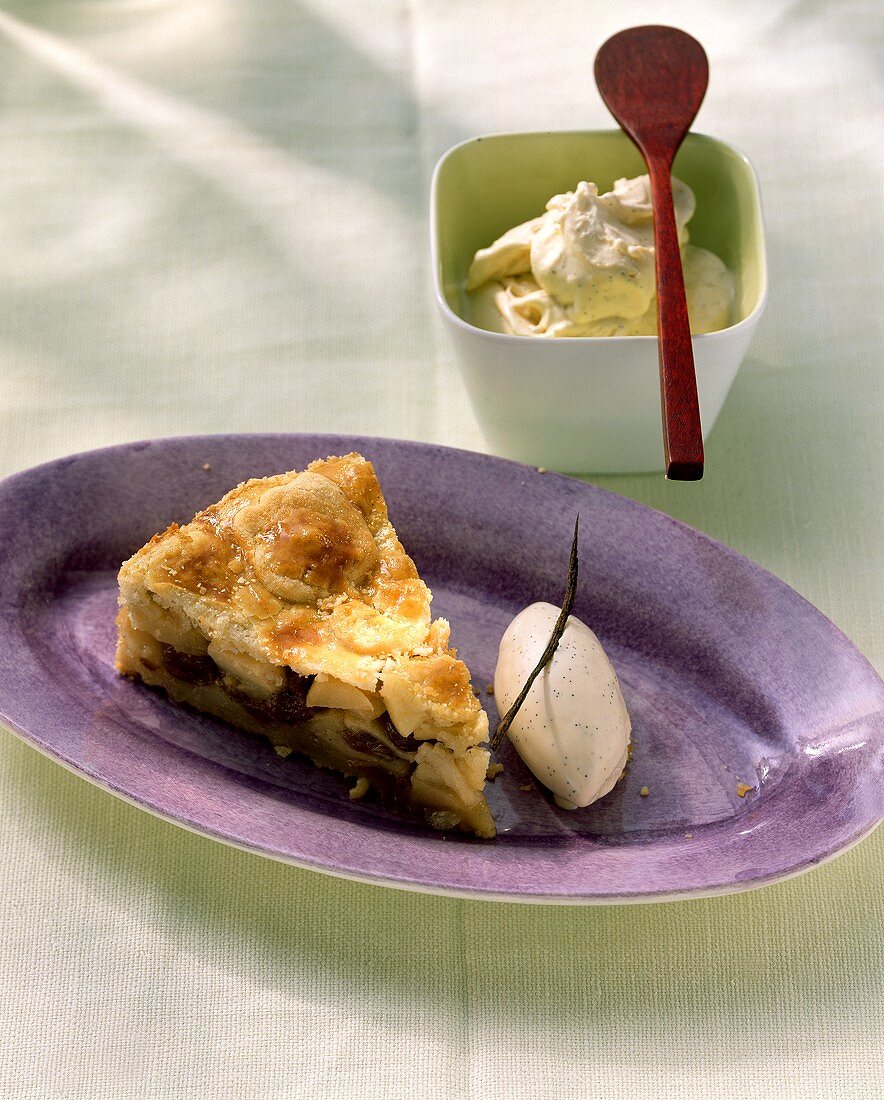 A piece of apple pie with vanilla ice cream