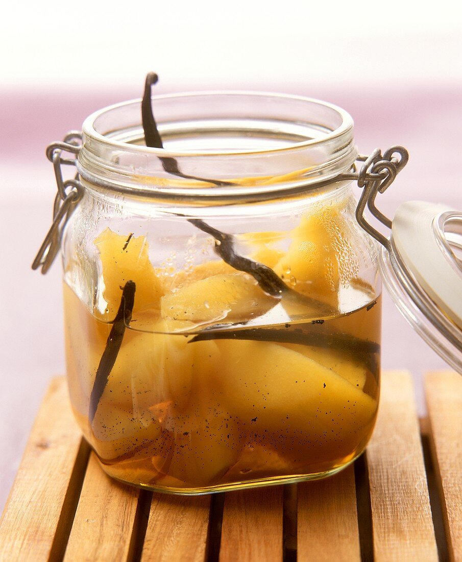 Quince compote with vanilla pods in preserving jar