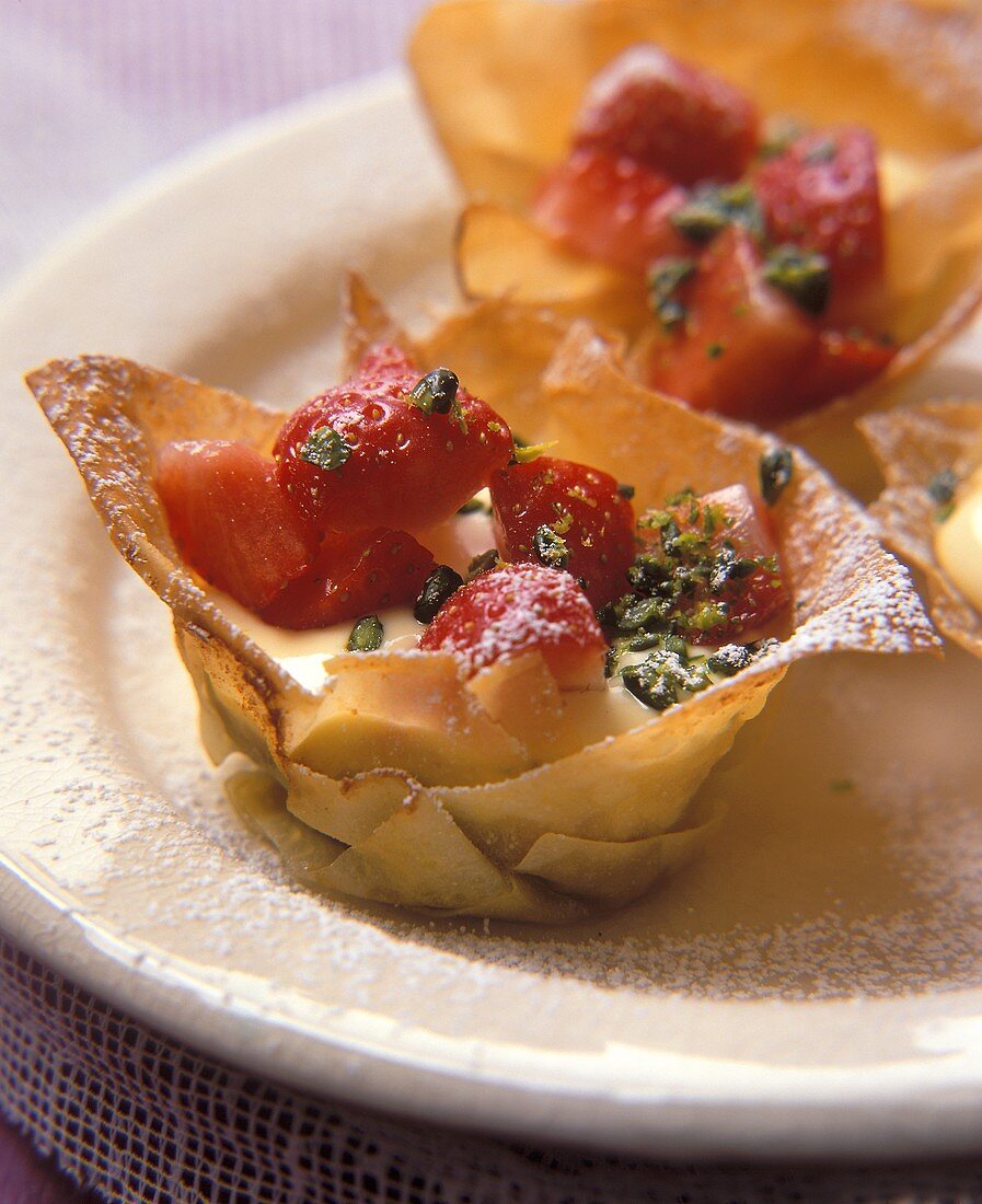 Filo pastry bowls filled with vanilla mousse & strawberries
