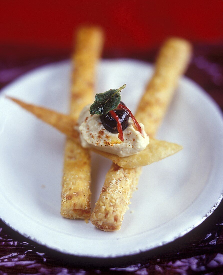 Cheese and paprika sticks with hummus