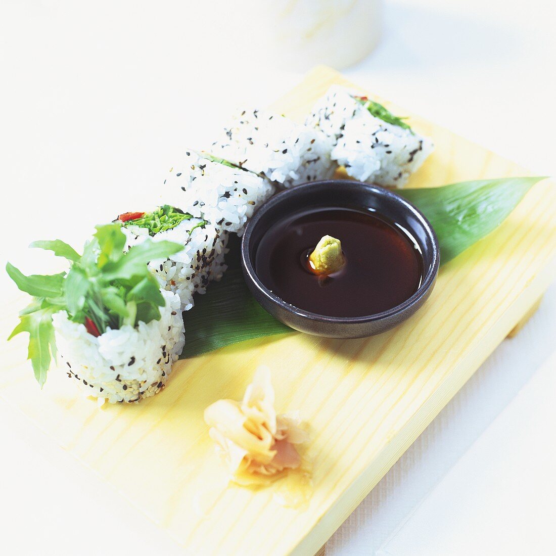 Vegetarian sushi (California rolls) soy sauce, wasabi, ginger
