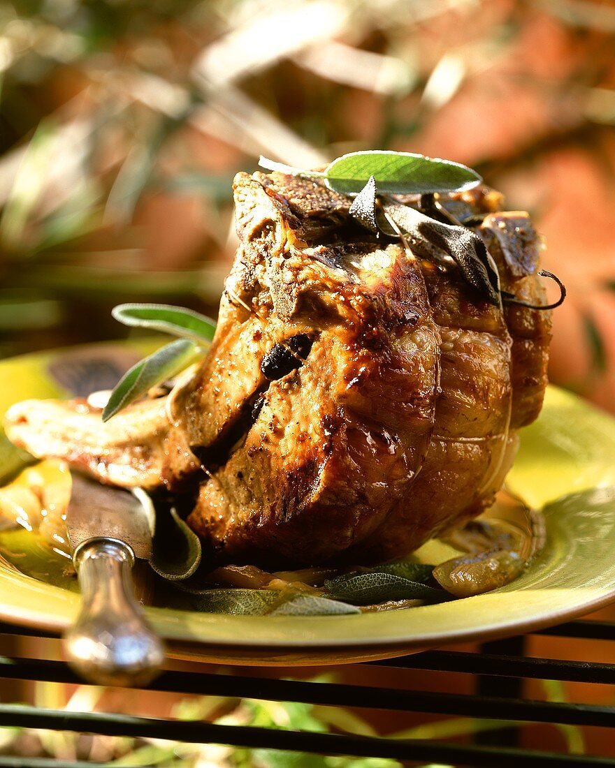 Roast pork with olive and anchovy stuffing and sage