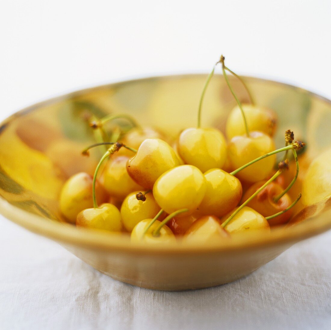 Yellow cherries in a bowl