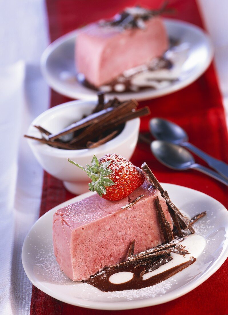 Strawberry parfait on chocolate cream sauce