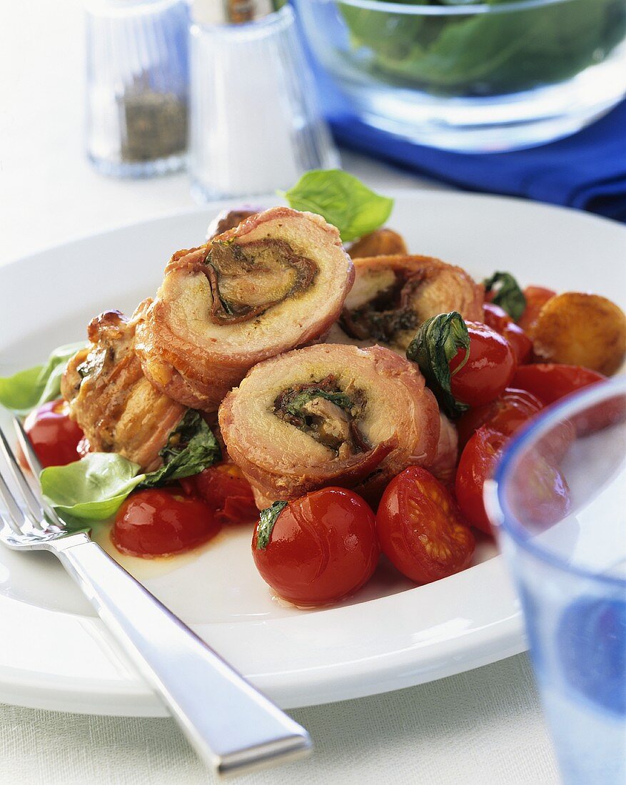 Stuffed pork roulades with cherry tomatoes