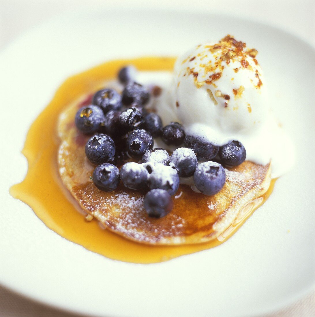 Pancakes with blueberries, maple syrup & vanilla ice cream
