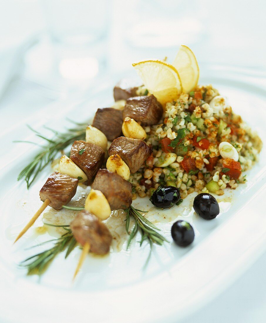 Lamb kebabs with garlic and tabouleh (bulgur salad)
