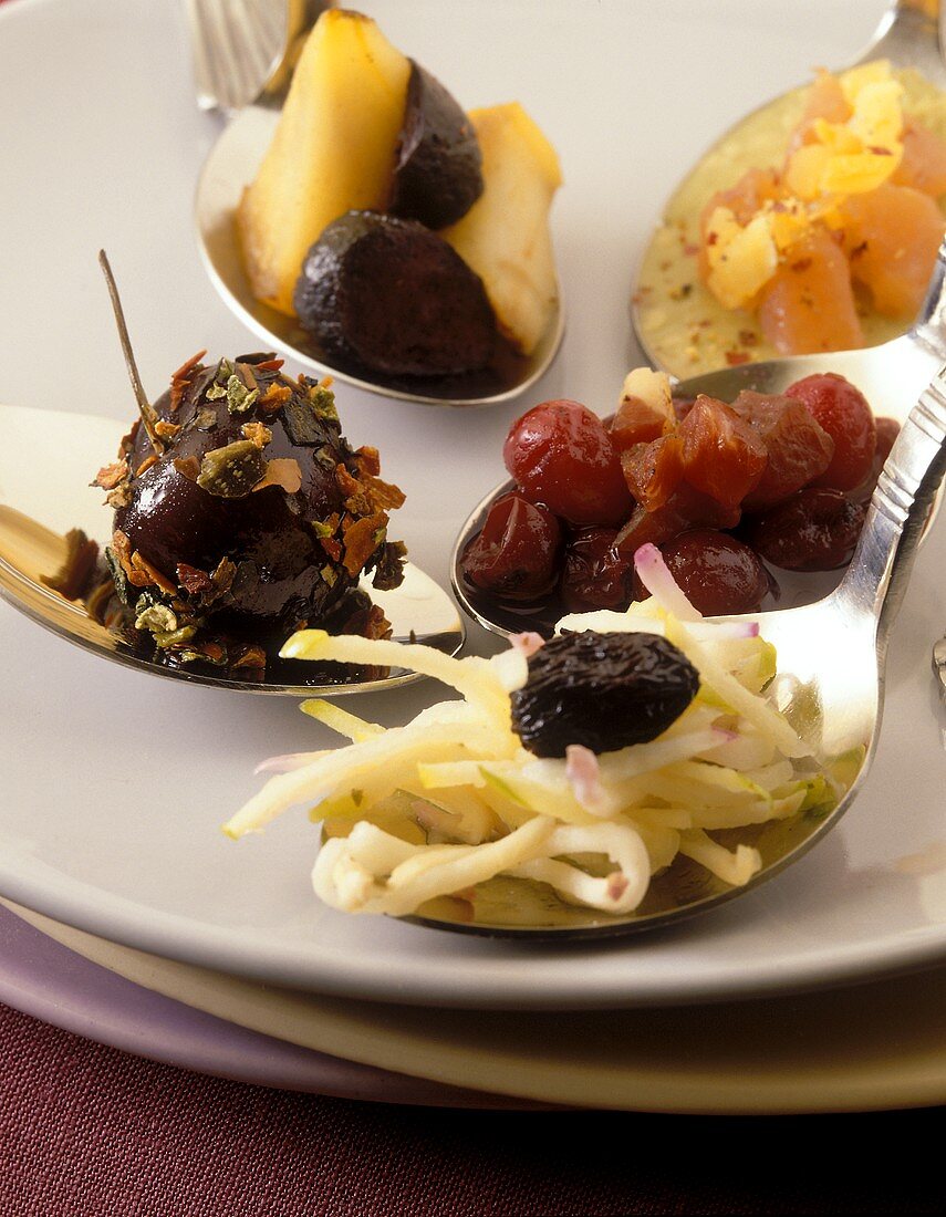 Various appetisers on spoons