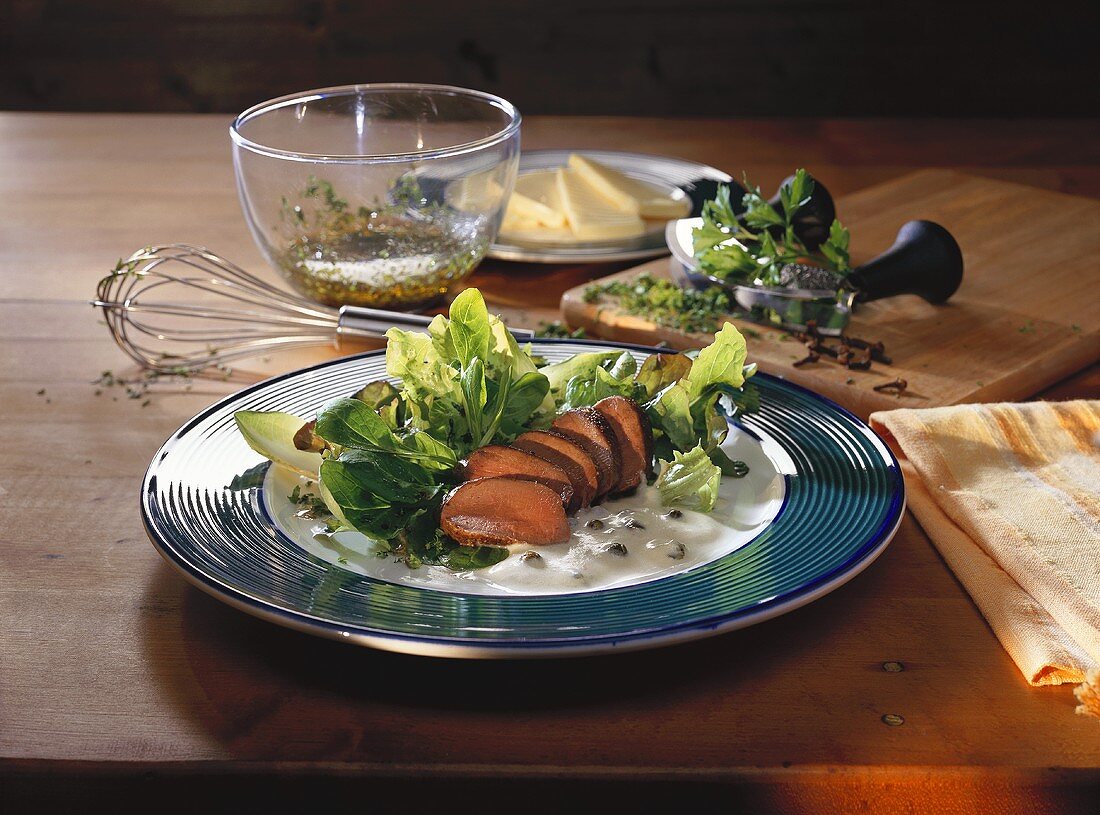 Hare fillet with pepper sauce on bed of lettuce