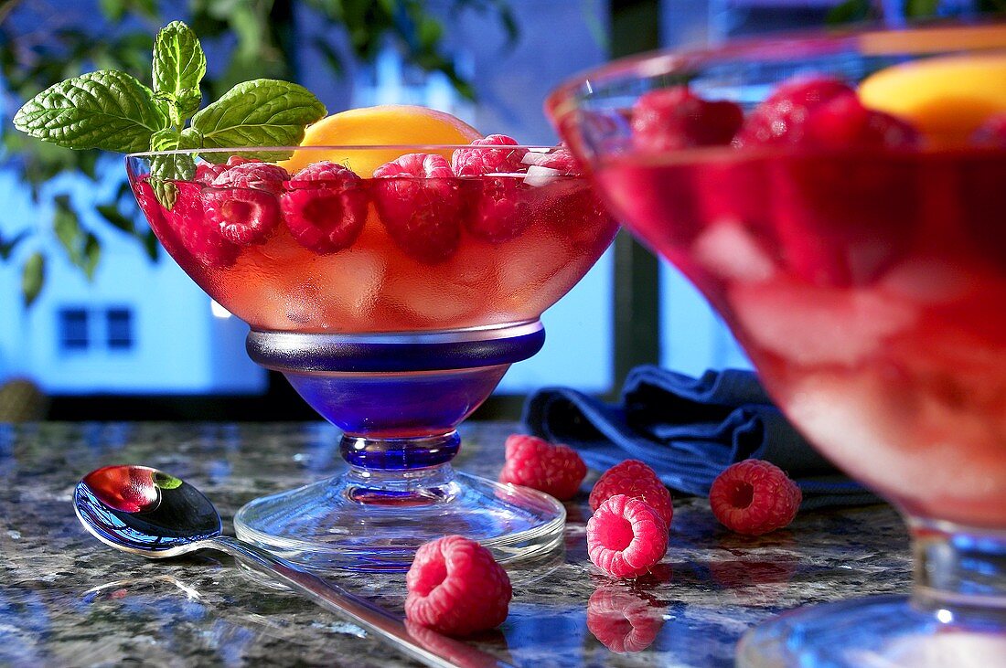 Fruit cocktail with raspberries on ice cream