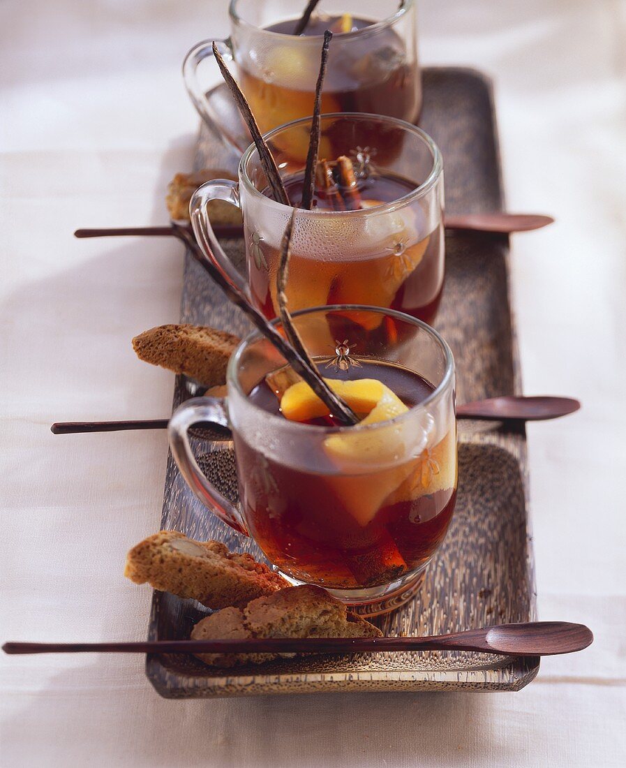 Three cups of cherry & amaretto punch with sloe juice