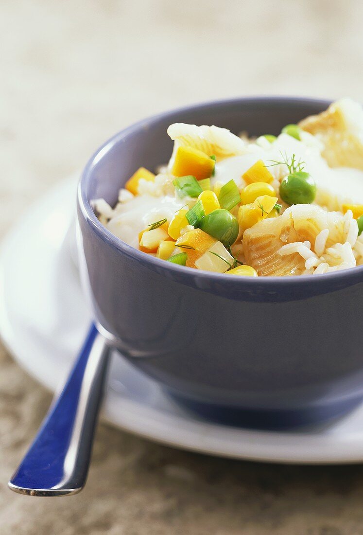 Fish ragout with corn, peas and rice